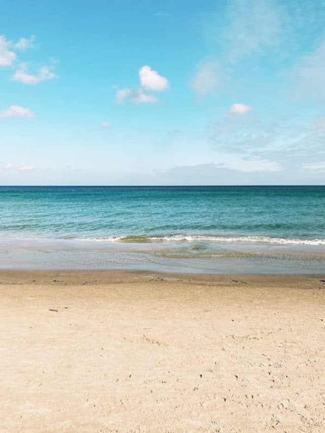 blue sea under blue sky and white clouds during daytime