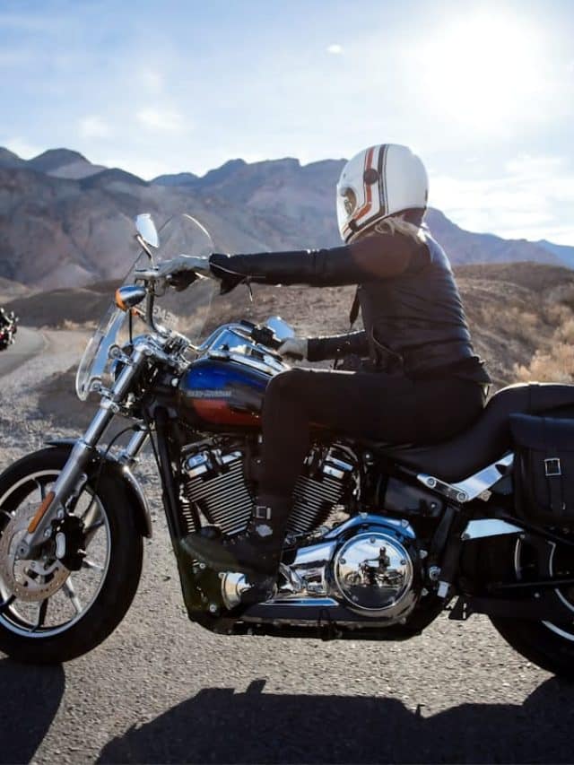 man riding touring motorcycle during daytime