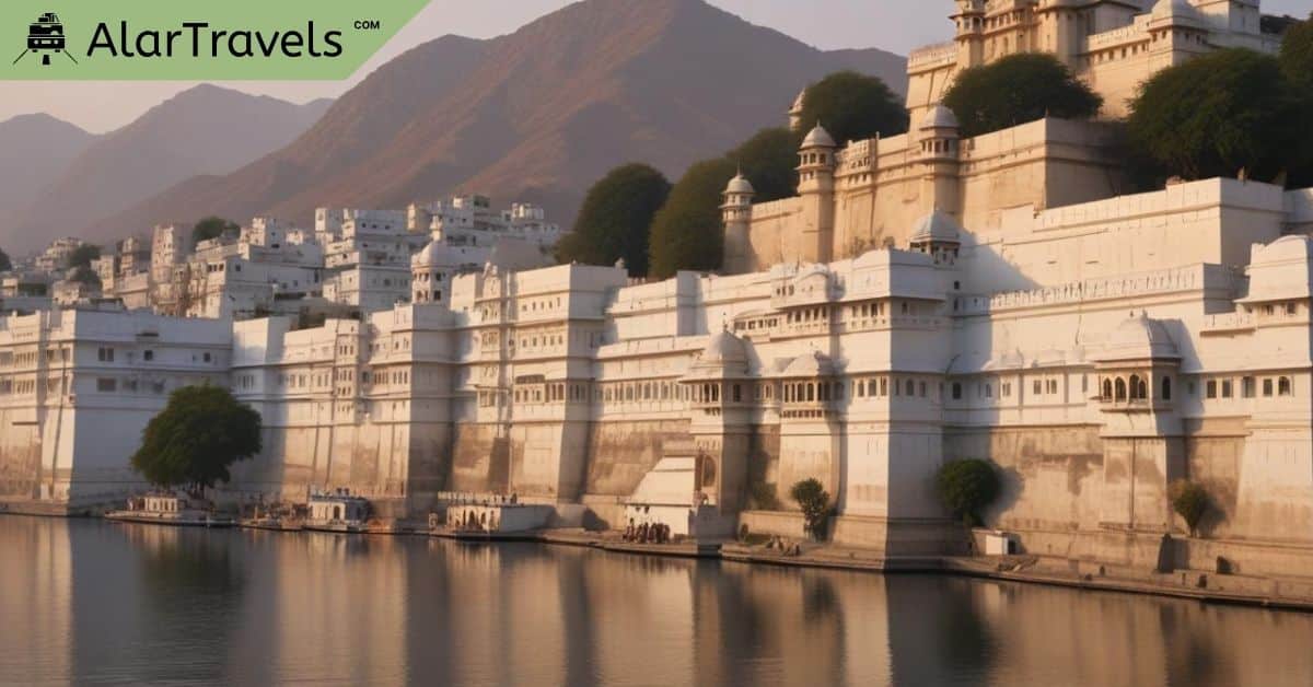 10 Romantic & Affordable Weekend Getaways for Couples 4 Lakeside view of a historic fort complex with white buildings and lush green trees, set against brown mountains at sunset. AlarTravels.com logo in the top left corner.